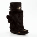 Black fur boot with decorative emblem on a white background