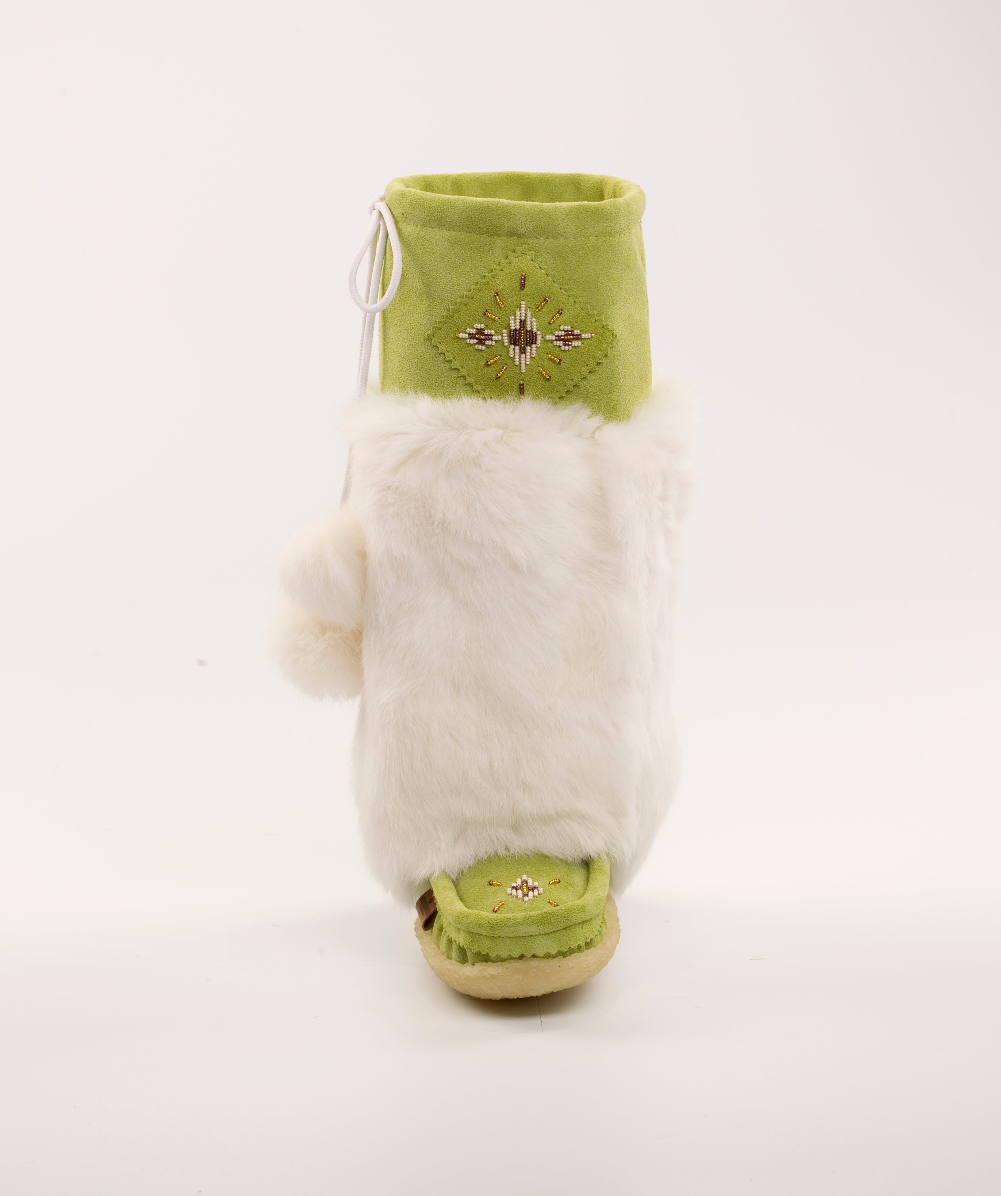 apple green mukluks being worn by a model
