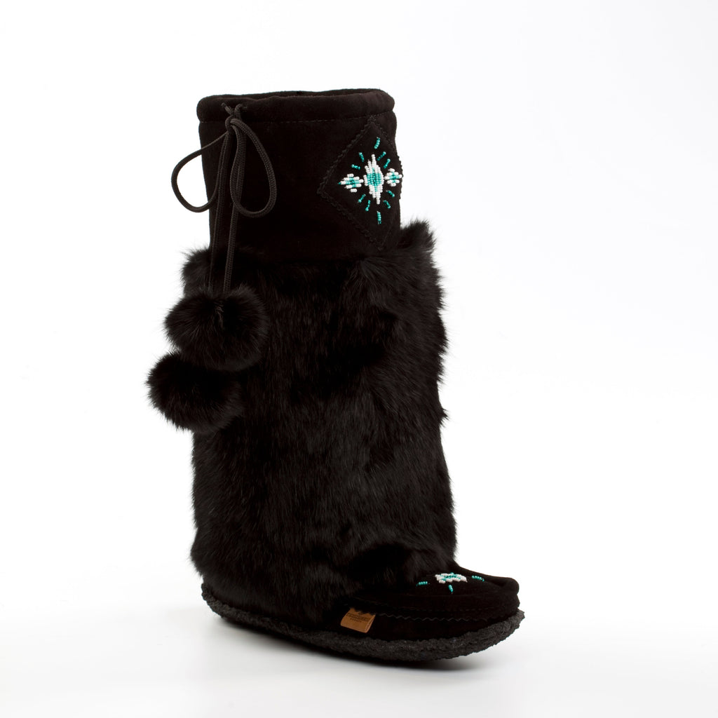 Black slipper with fur trim on a white background