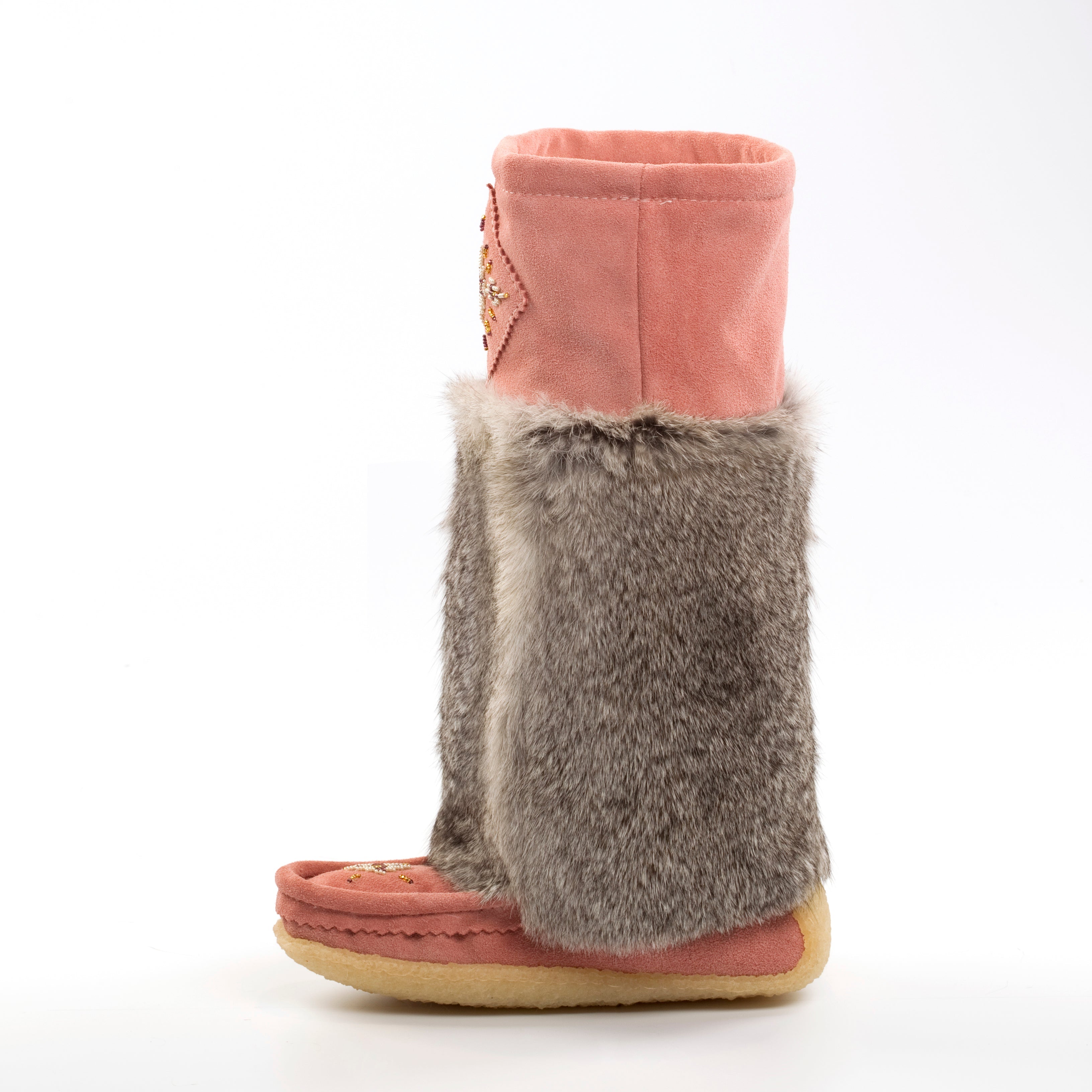 Pink mukluks with gray fur trim on a white background