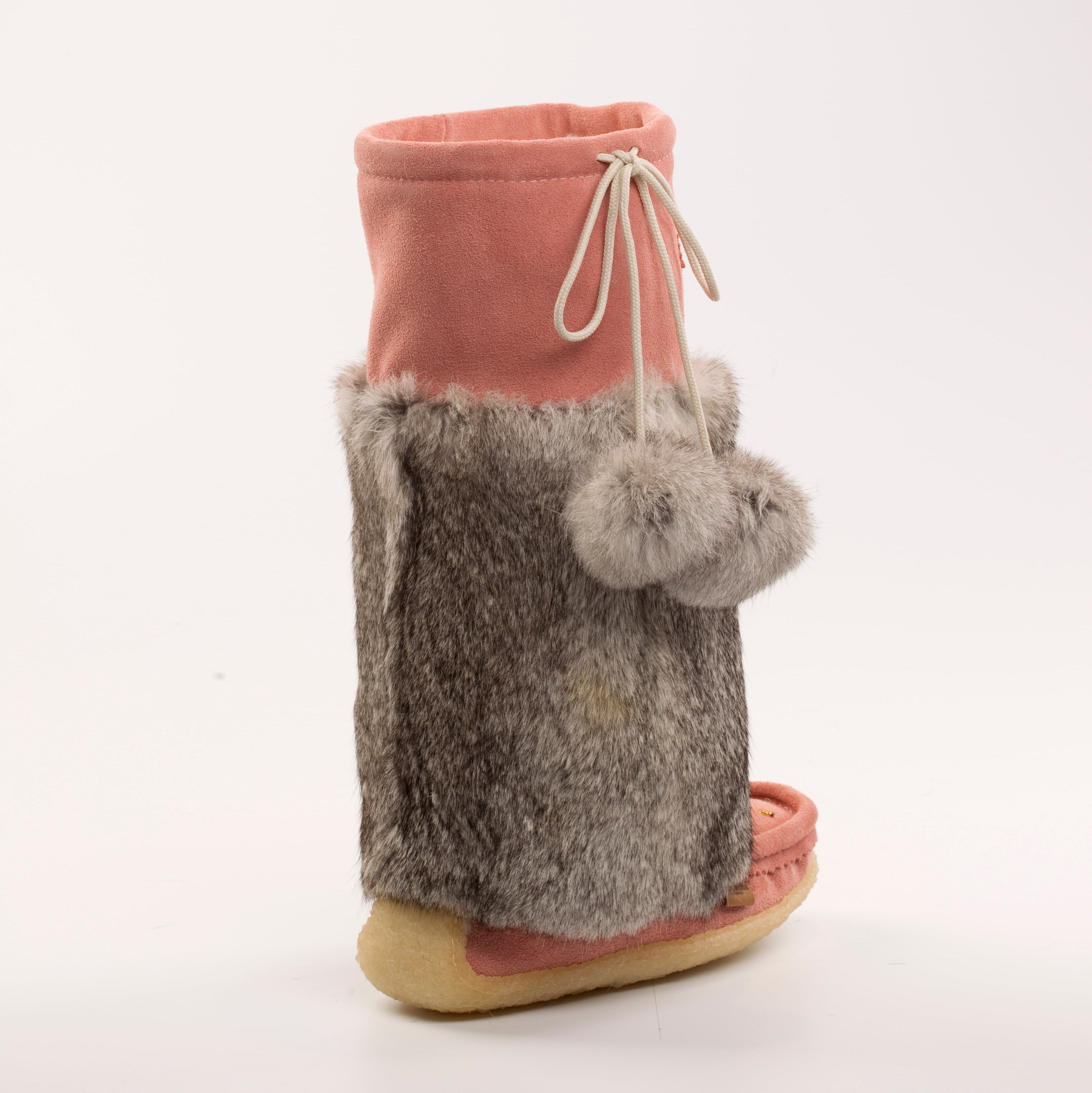 Pair of mukluks with pink top and gray fuzzy bottom on a white background