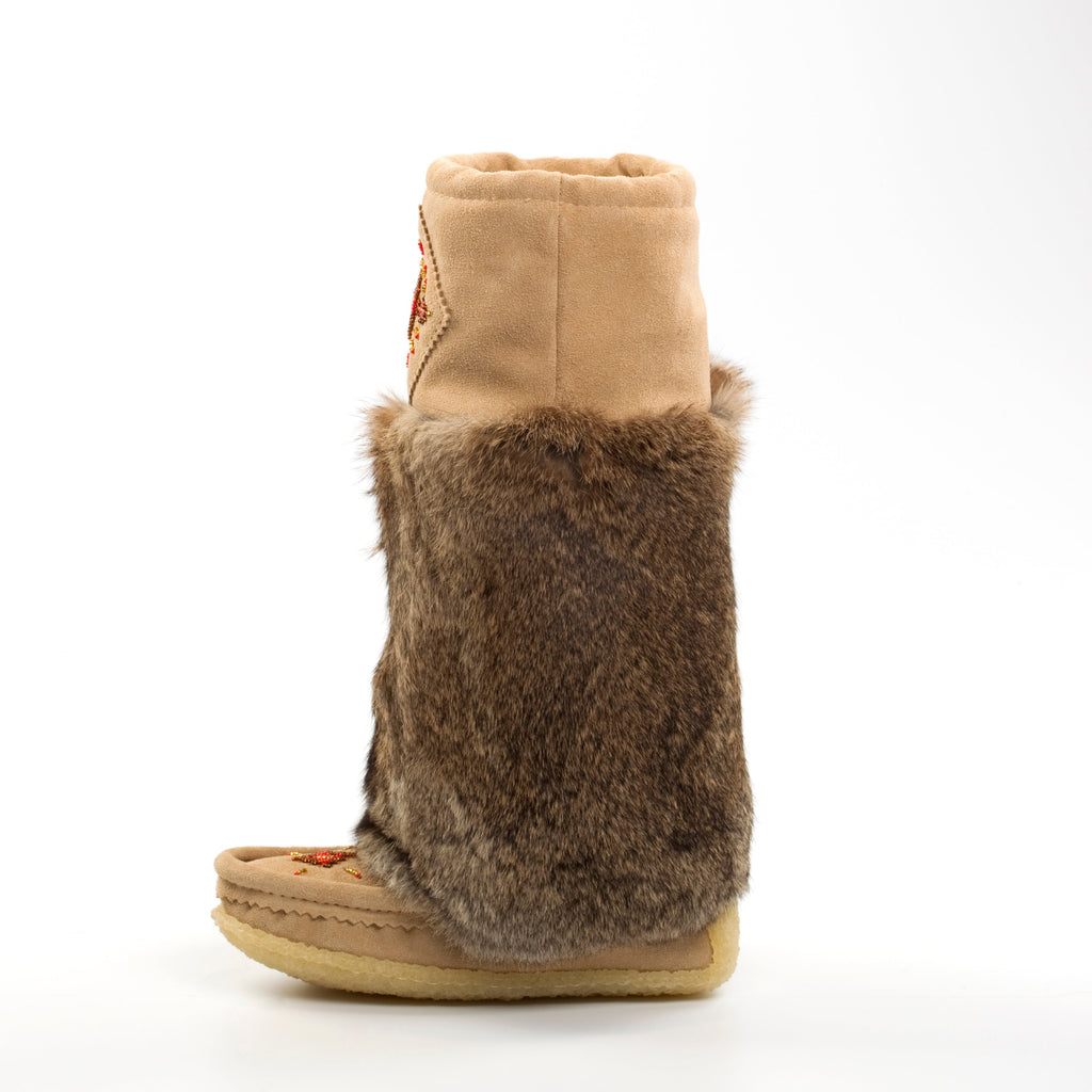 Tan boot with brown fur trim on a white background