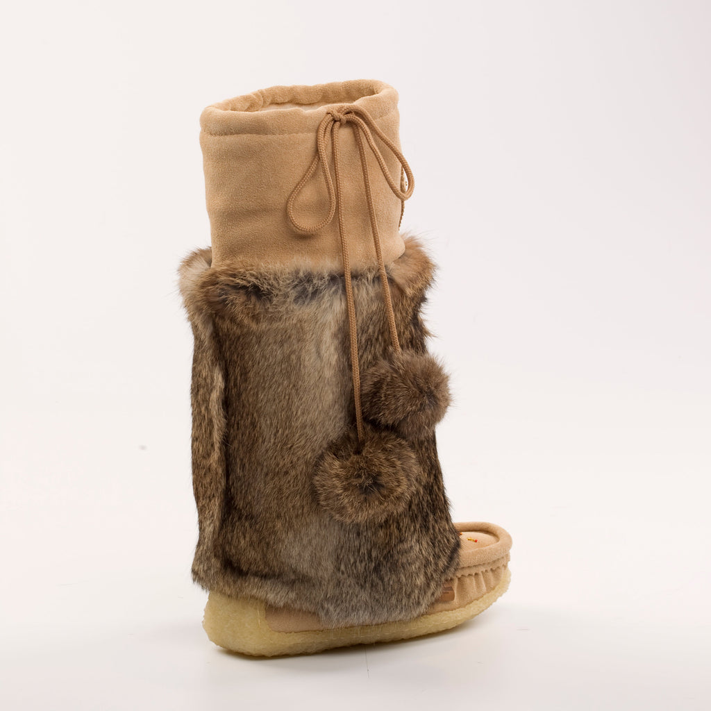 Tan boot with fur trim on a white background