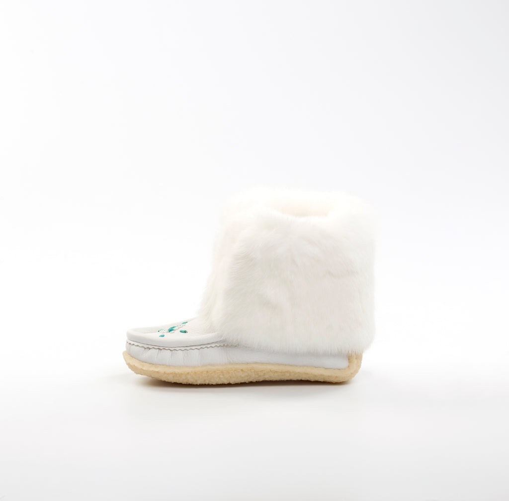 White mukluks with a sole on a white background