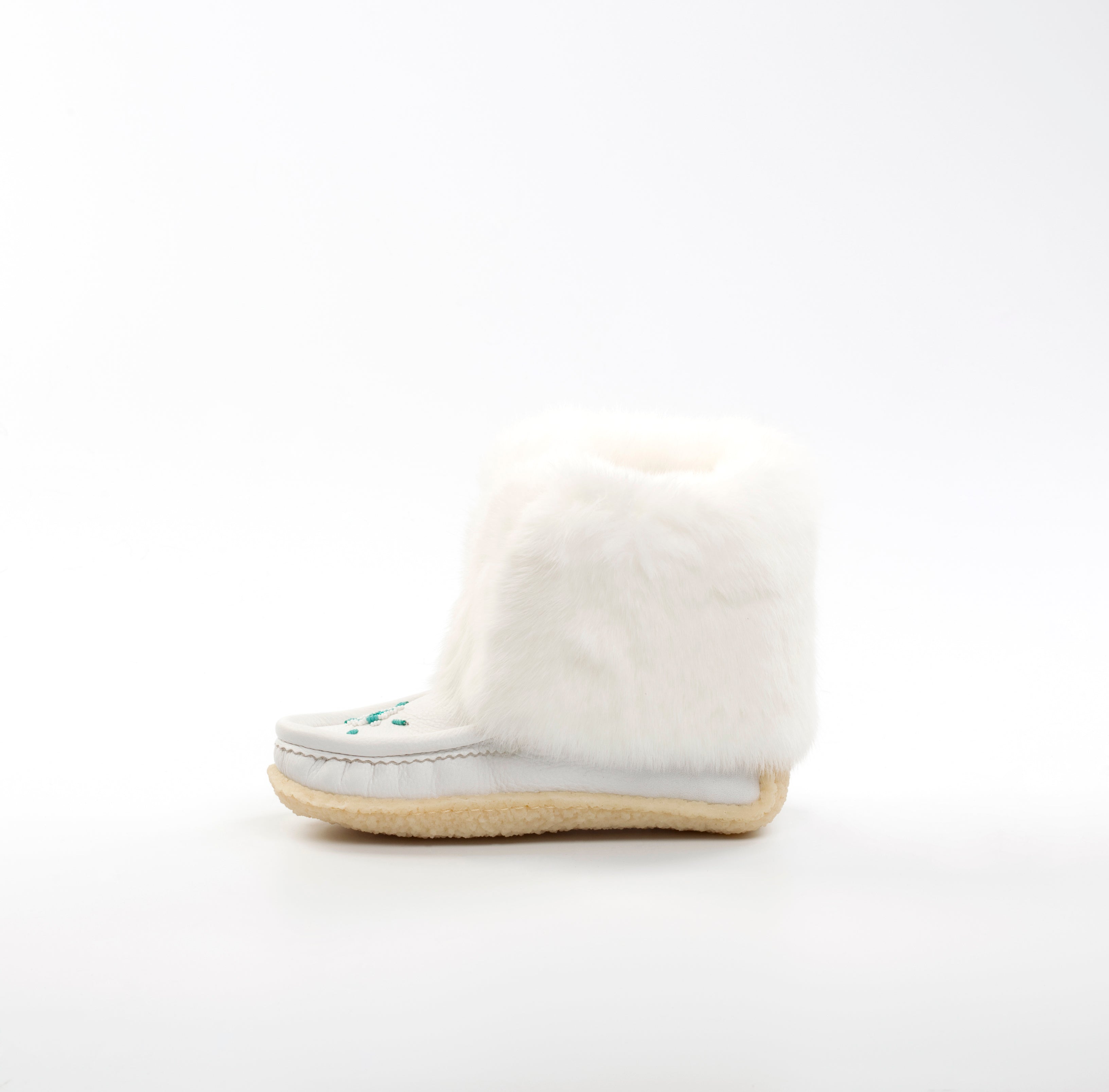 White mukluks with a sole on a white background