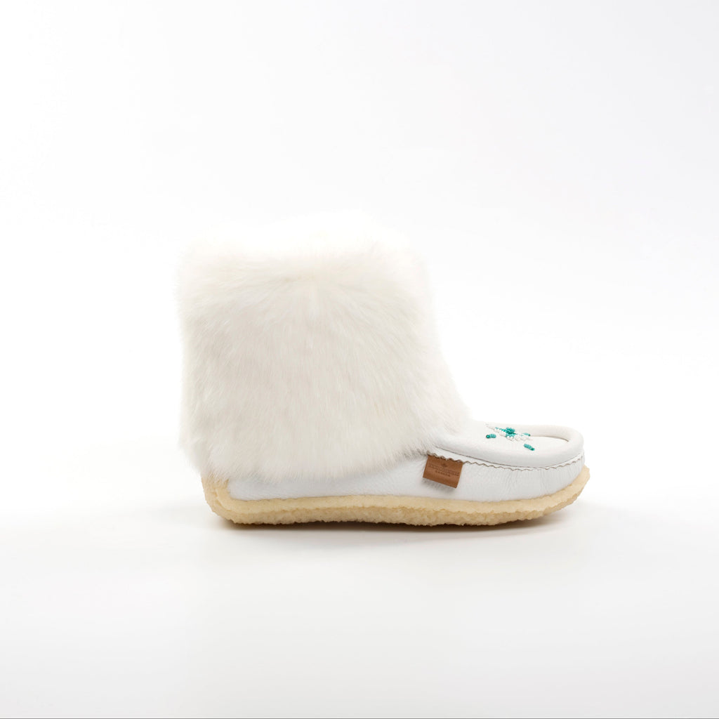 White mukluk with fur on a white background