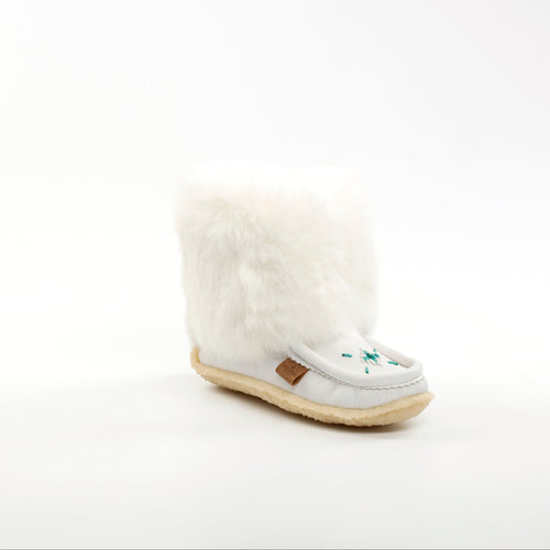 White mukluk with a cream sole on a white background
