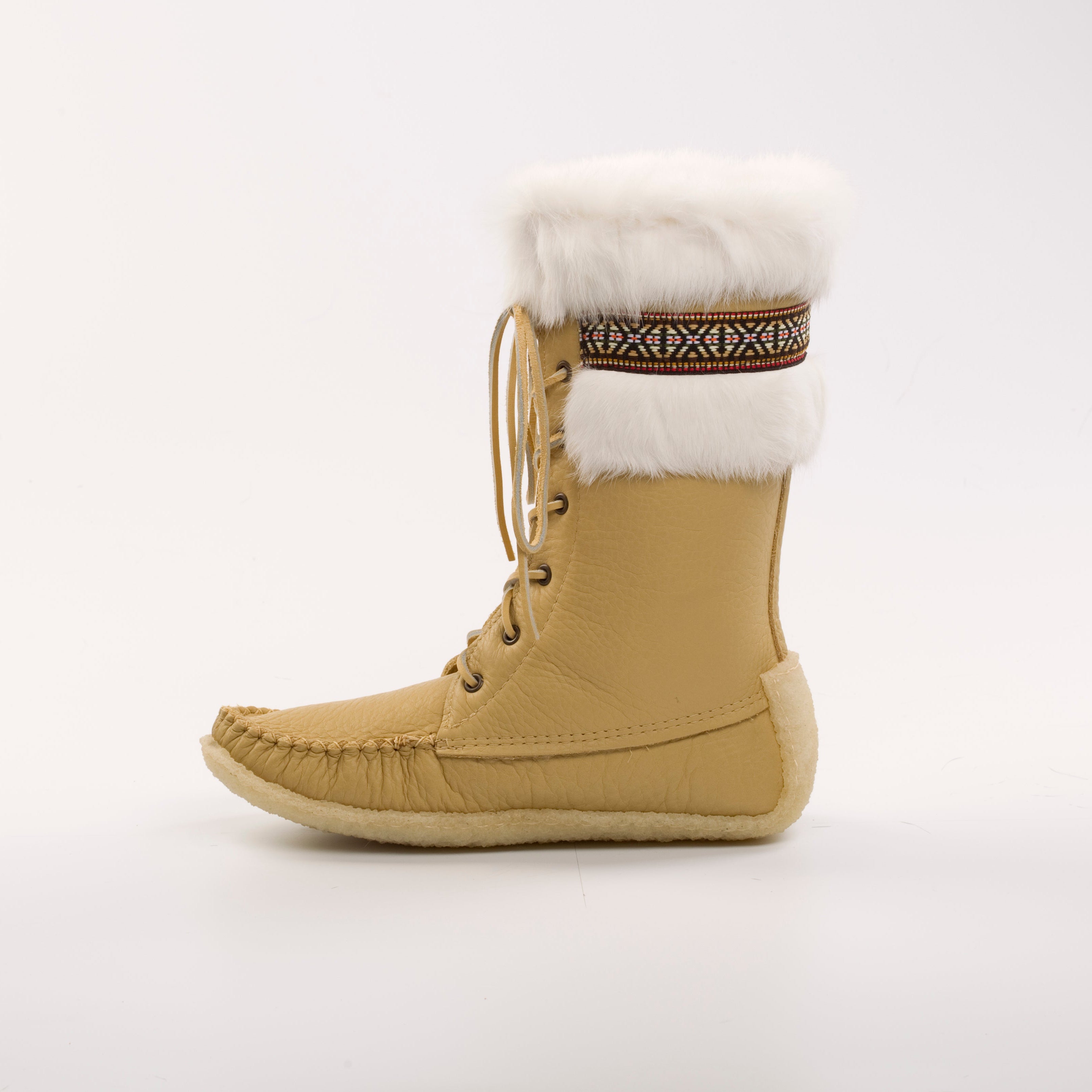 Beige winter boot with fur lining on a white background