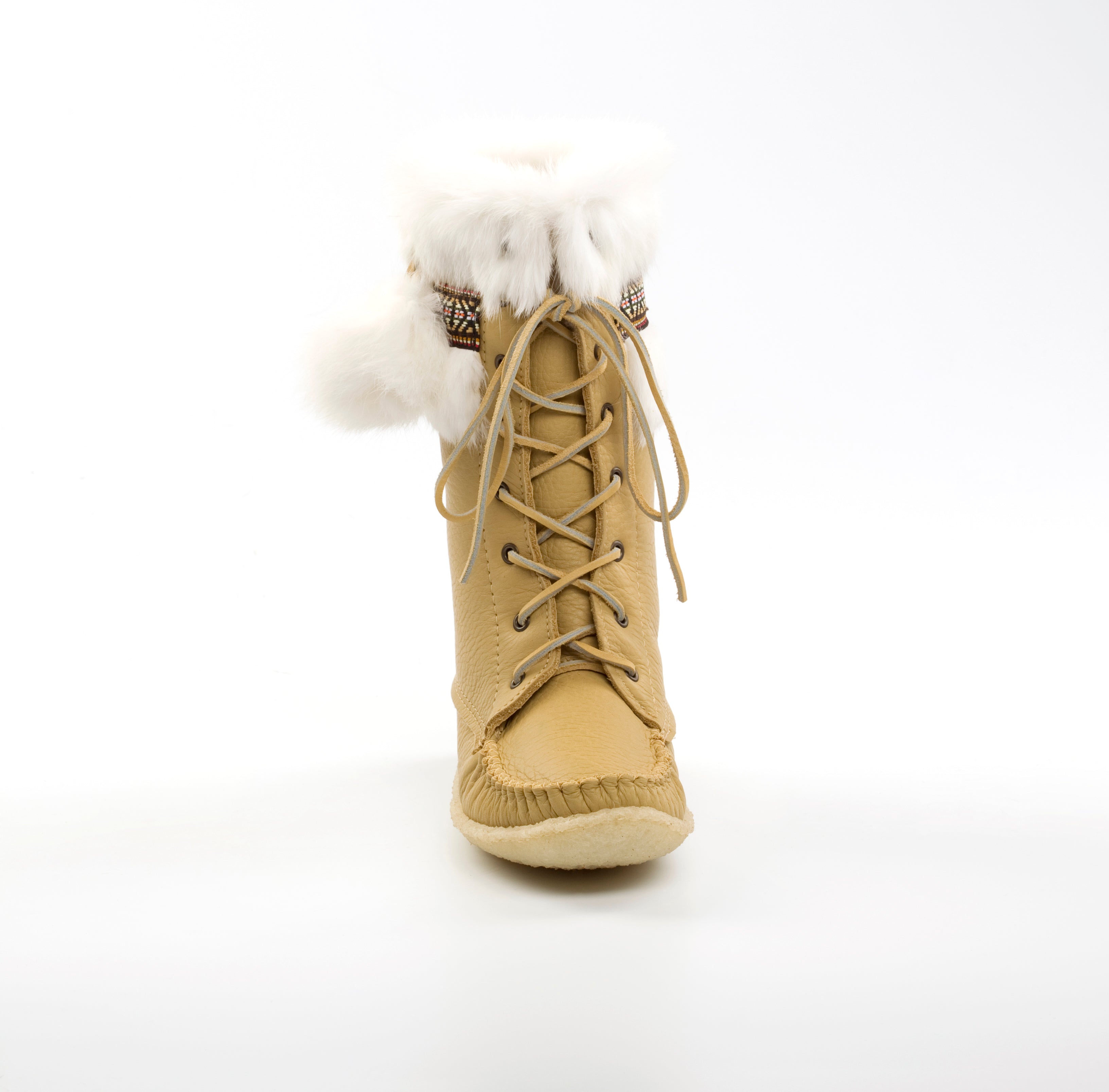 Tan winter boot with fur lining on a white background