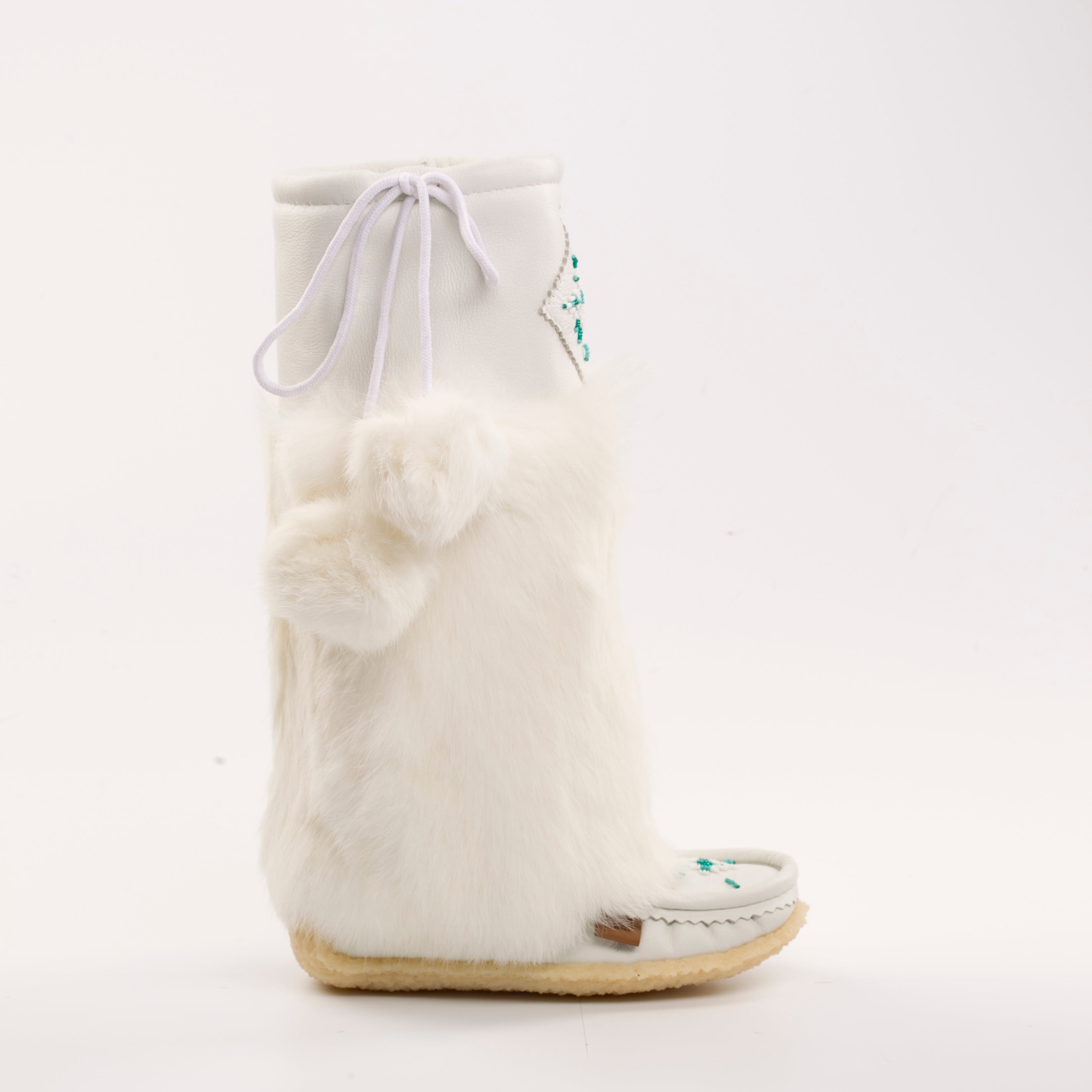 White furry slippers with a drawstring on a white background