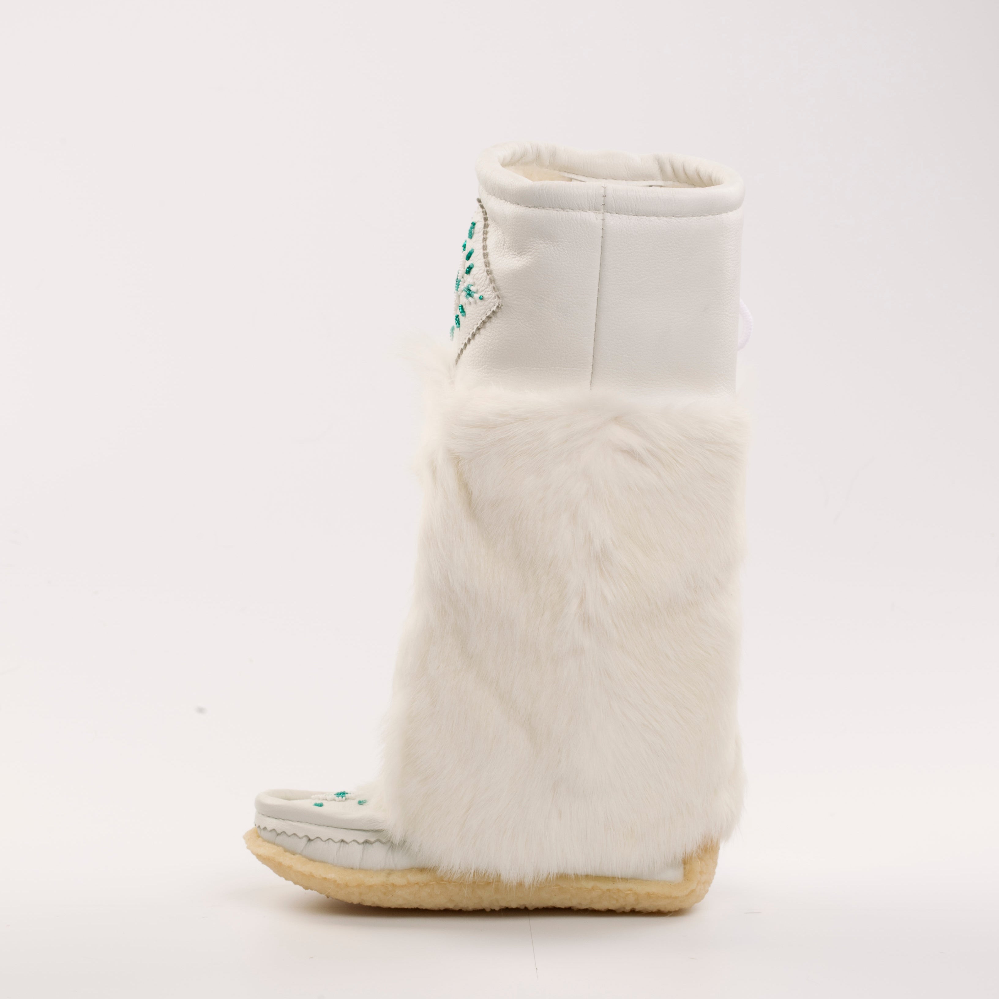 White boot with fur trim on a white background