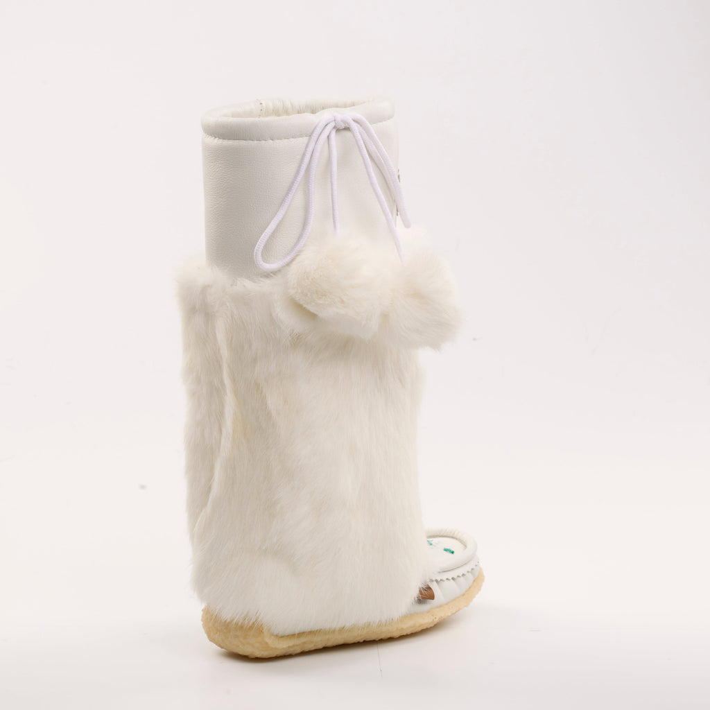 White mukluk boot with fur trim on a white background