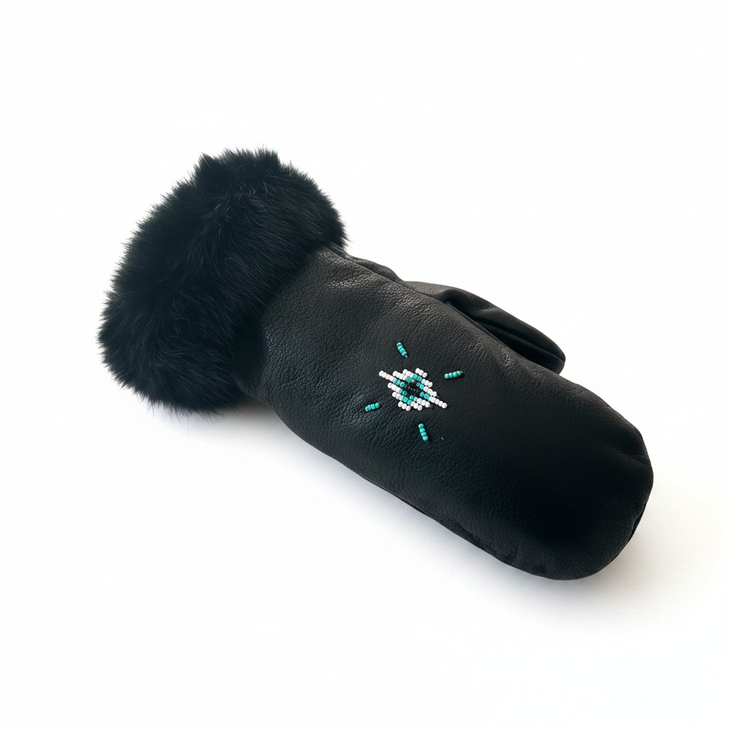 Black fur-trimmed glove with decorative handsewn glass beads with a white background 
