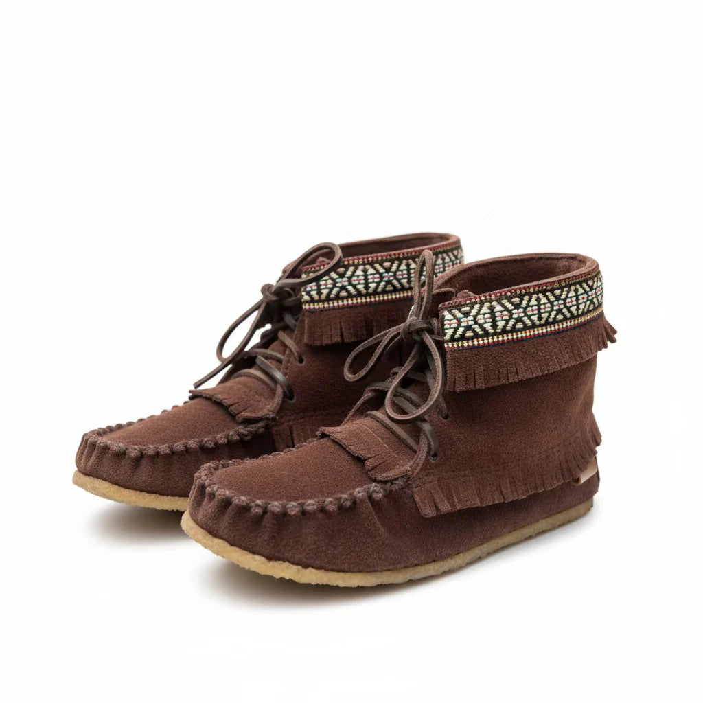 Pair of brown moccasin boots with decorative laces on a white background