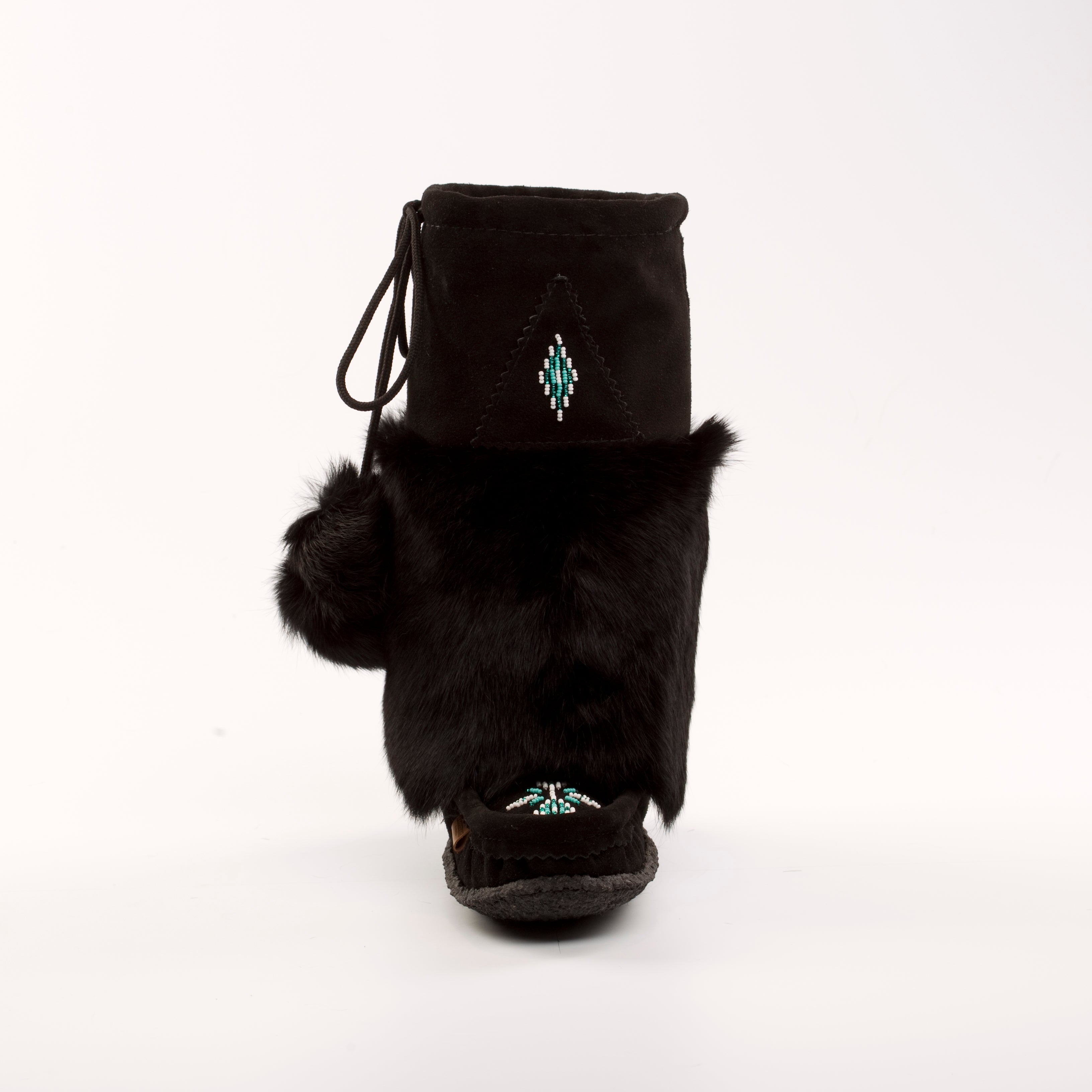 Black fur-lined boot with pom-poms on a white background