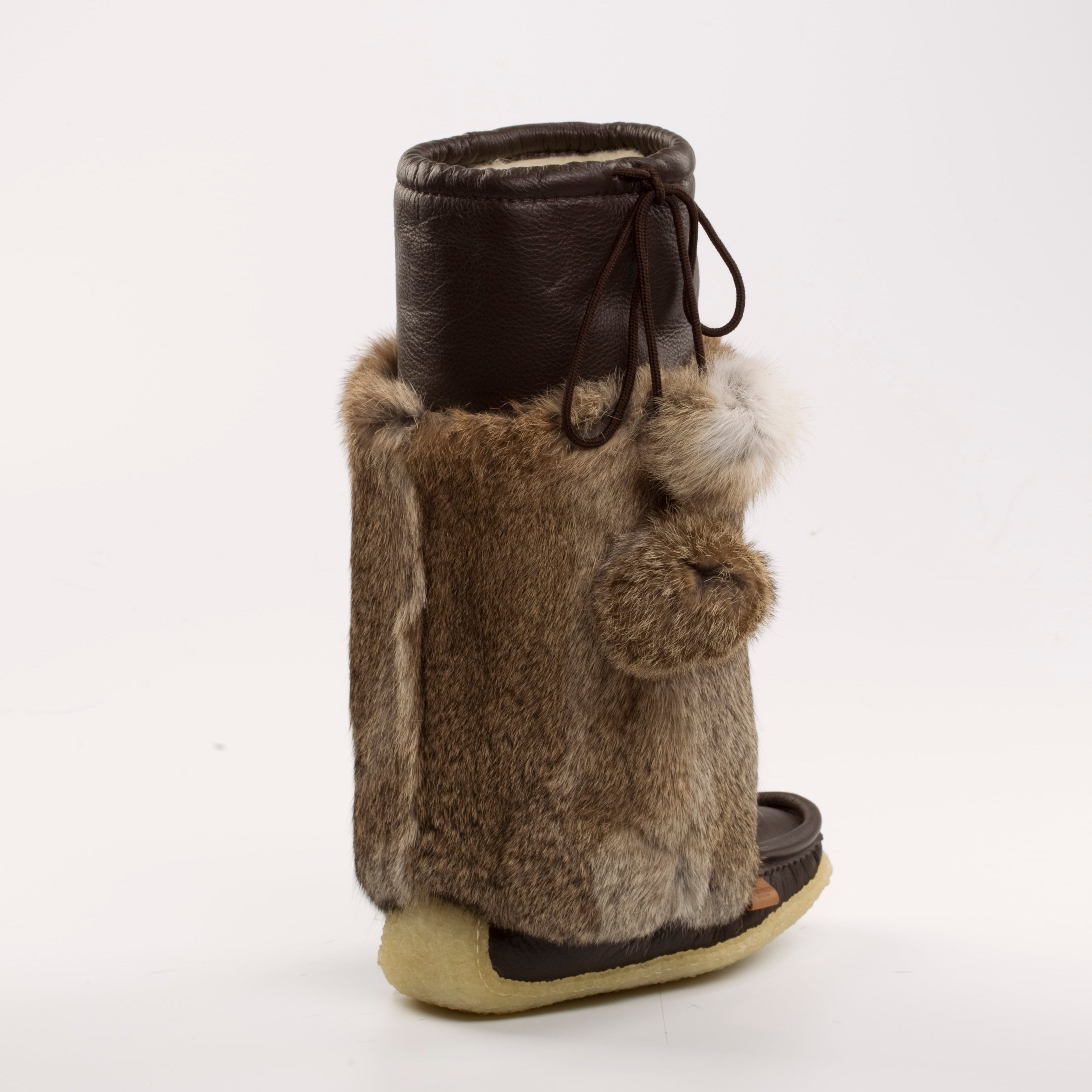 Brown mukluk fur boot on a white background