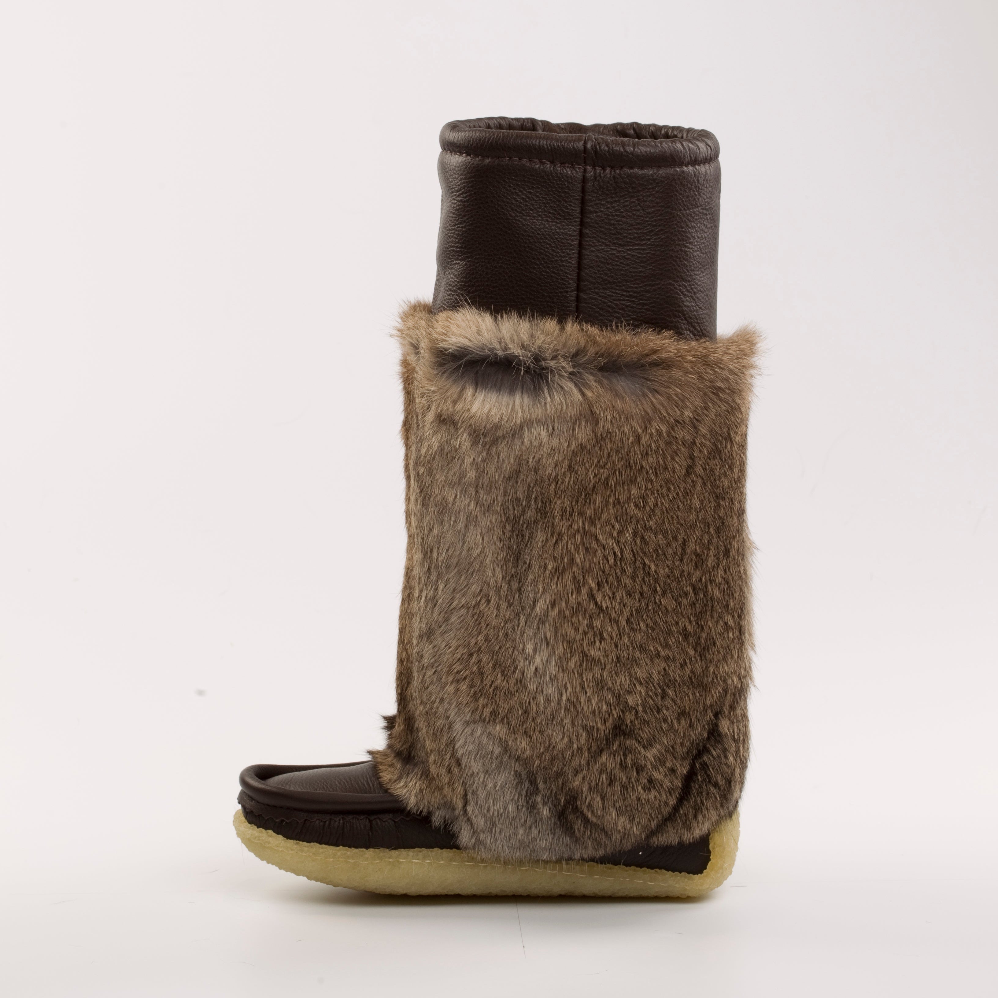 Brown boot with fur cuff on a white background
