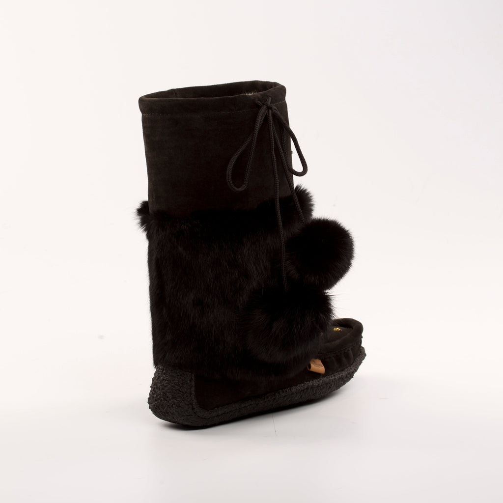 Black boot with fur trim on a white background