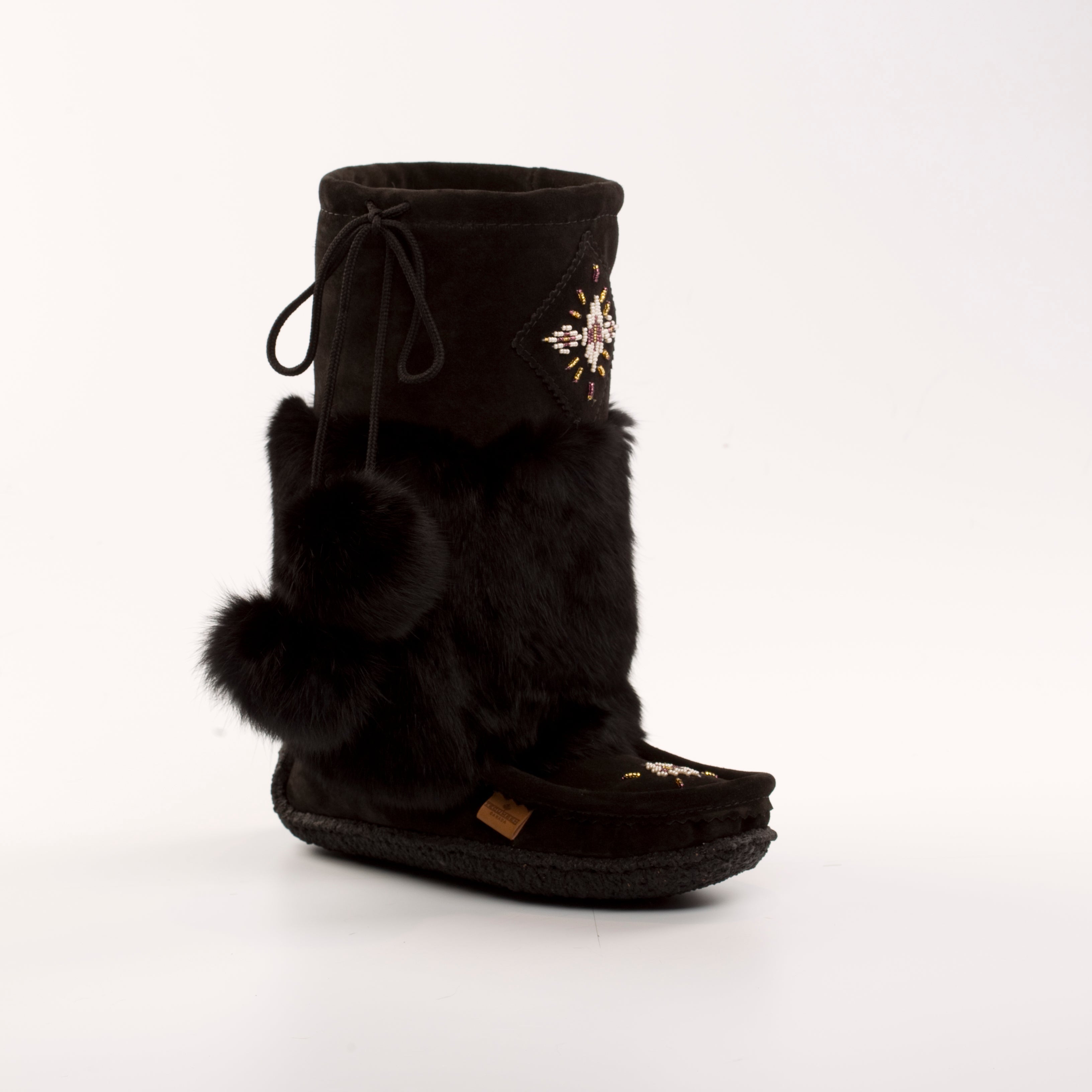 Black Canadian made mukluk with fur trim on a white background